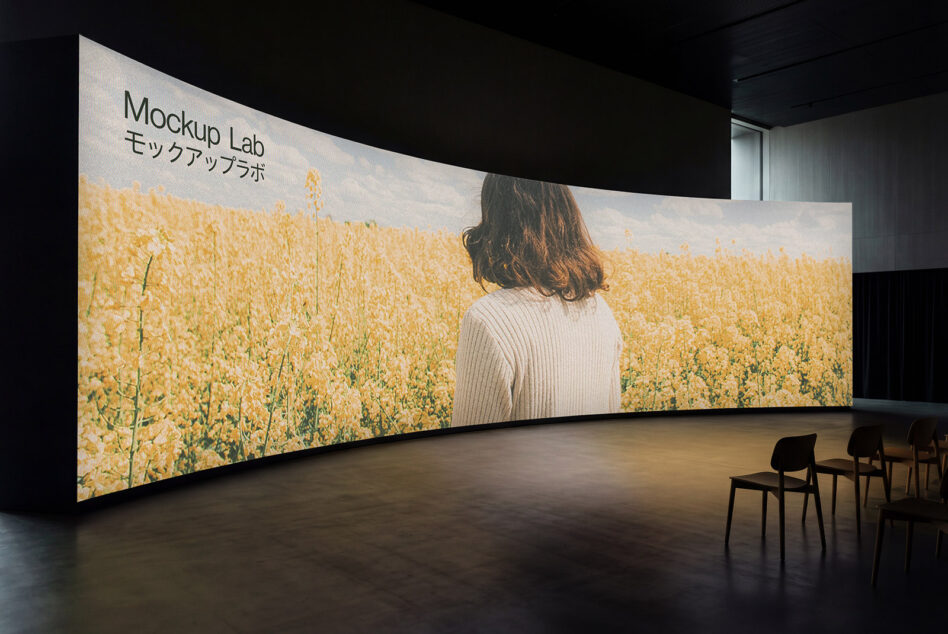 Wide curved screen mockup showing woman in field with golden wheat landscape