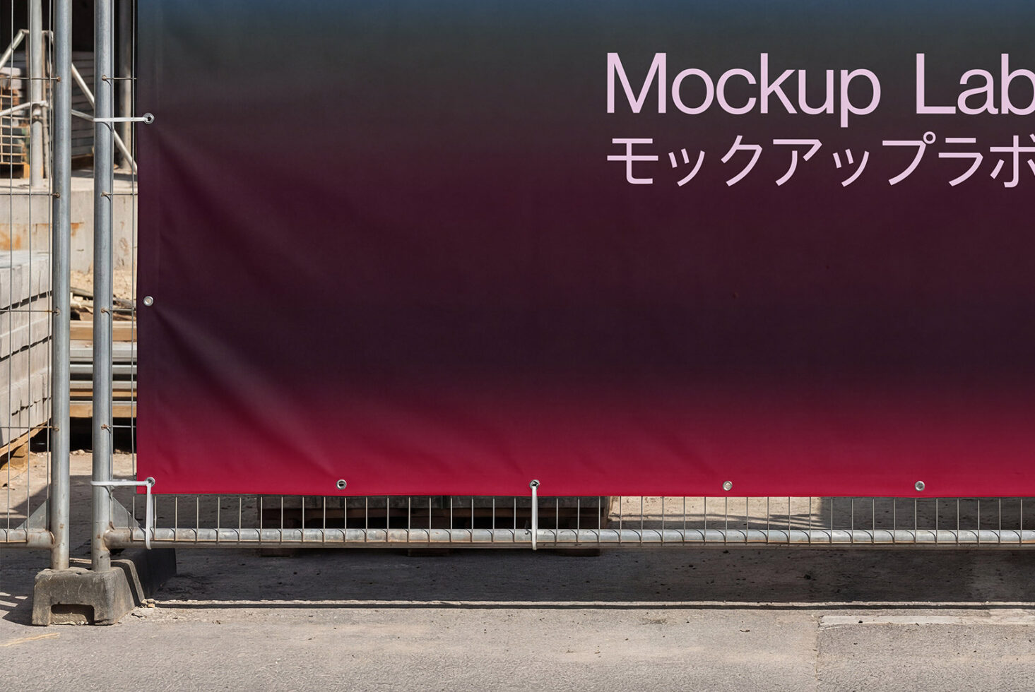 Construction barrier with burgundy gradient vinyl showing Mockup Lab branding