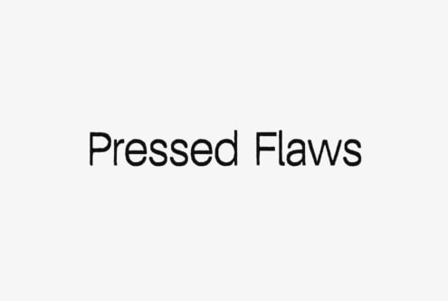 Pressed Flaws typeface displayed as bold black text on light background