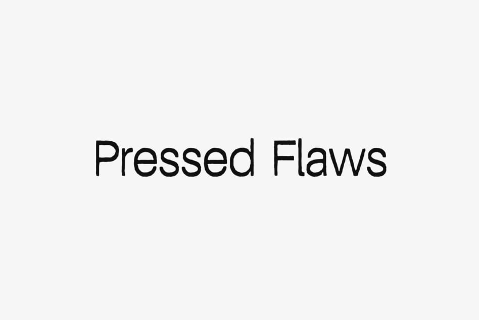Pressed Flaws typeface displayed as bold black text on light background
