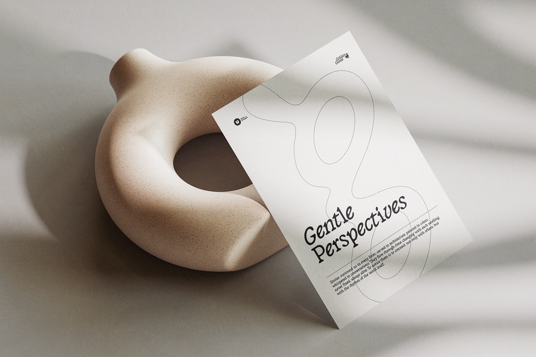 Beige sculptural form holding white paper with Gentle Perspectives text mockup