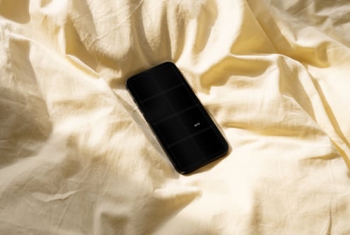 Black phone on cream fabric with 6-cell grid mockup layout