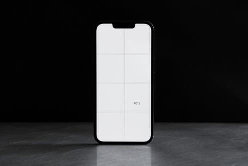 White iPhone with 6-cell grid layout, notch visible at top