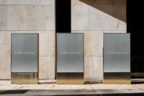 Three modern shopfront windows with neutral gray display mockup setup