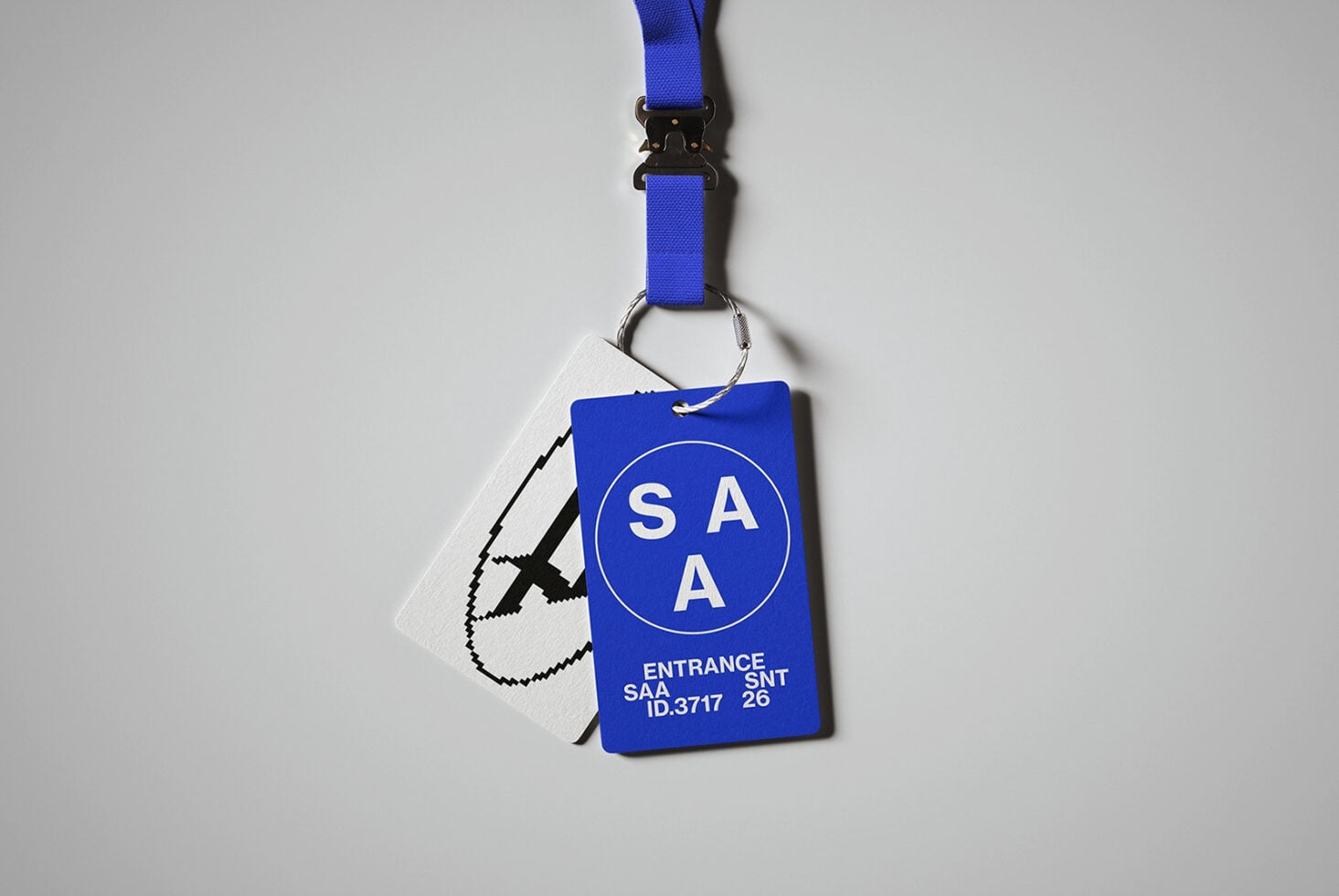 Blue lanyard with SAA entrance badge showing ID number SNT 26