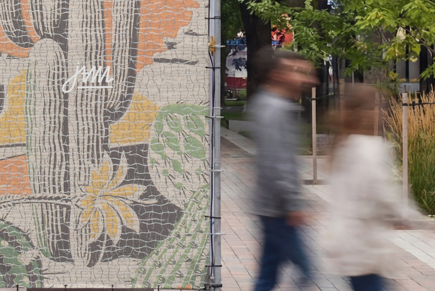 Botanical line art mural with yellow, orange, green on cracked brick