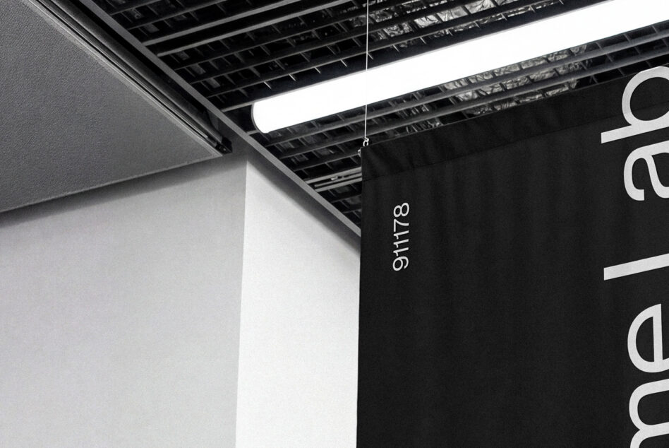 Hanging black banner with vertical white text in modern minimalist industrial space