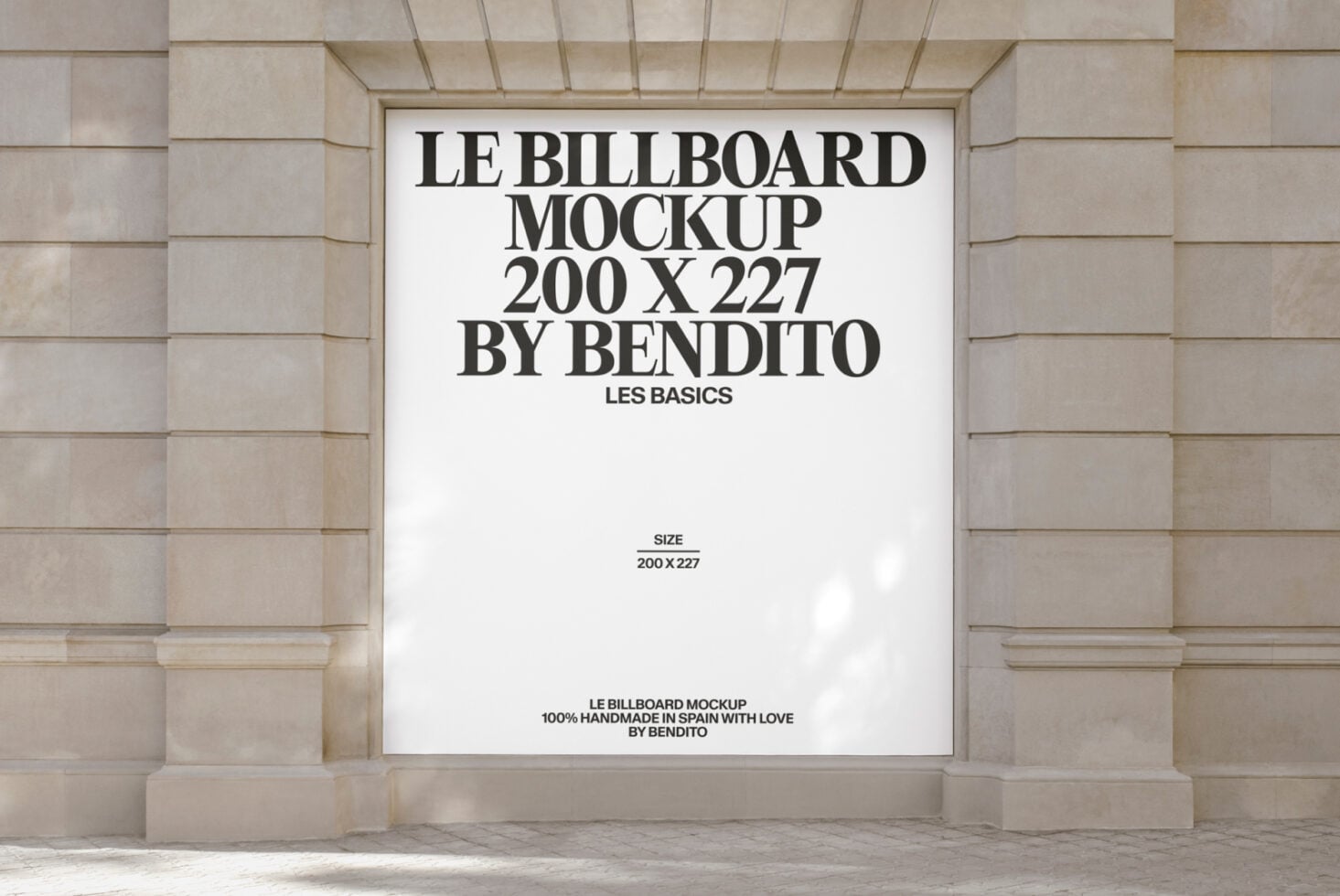 White billboard mockup on stone facade with black typography layout