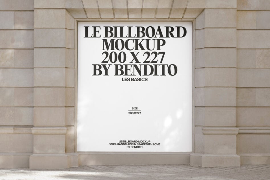 White billboard mockup on stone facade with black typography layout