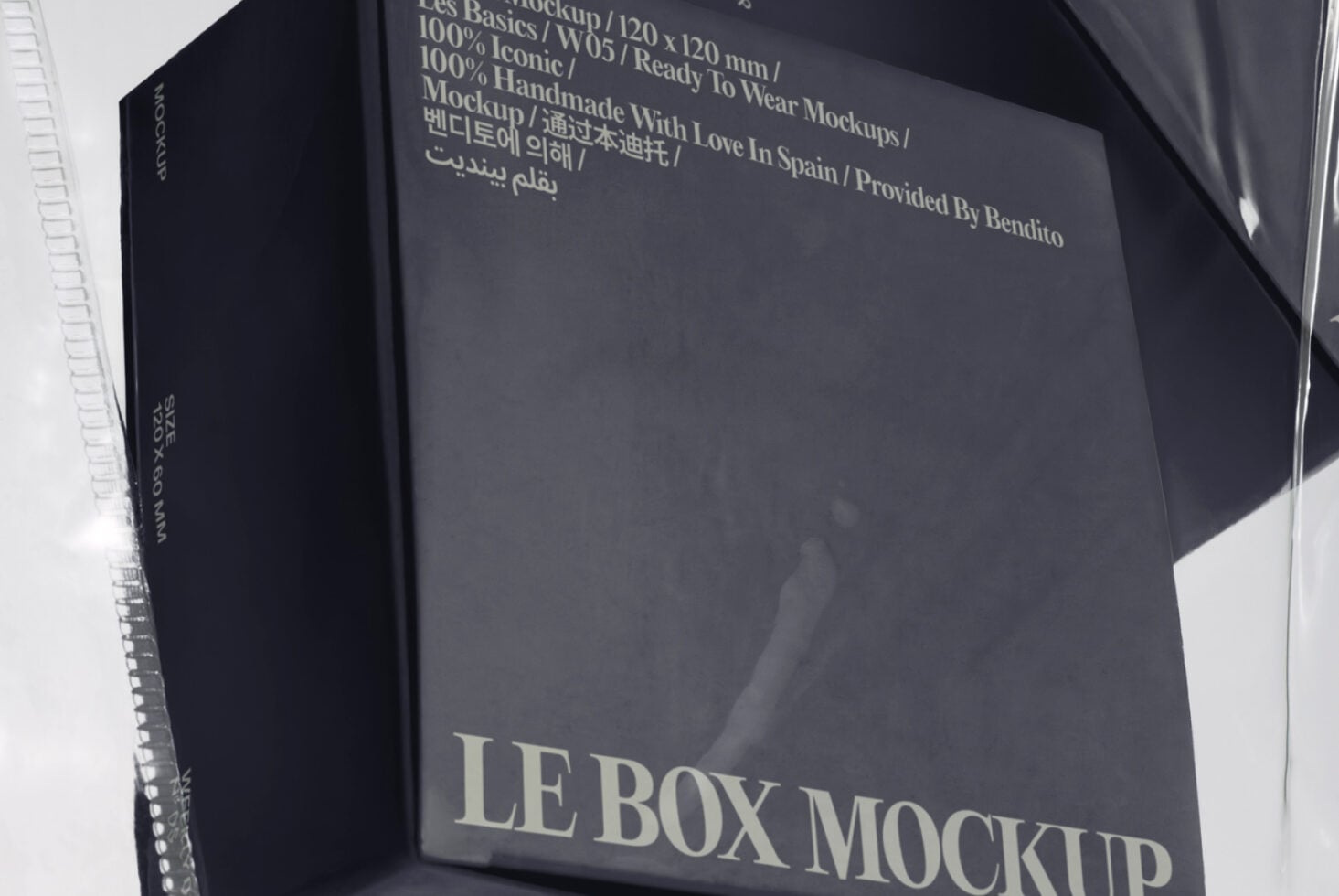 Dark navy box mockup with cream text showing product specs, shot at angle