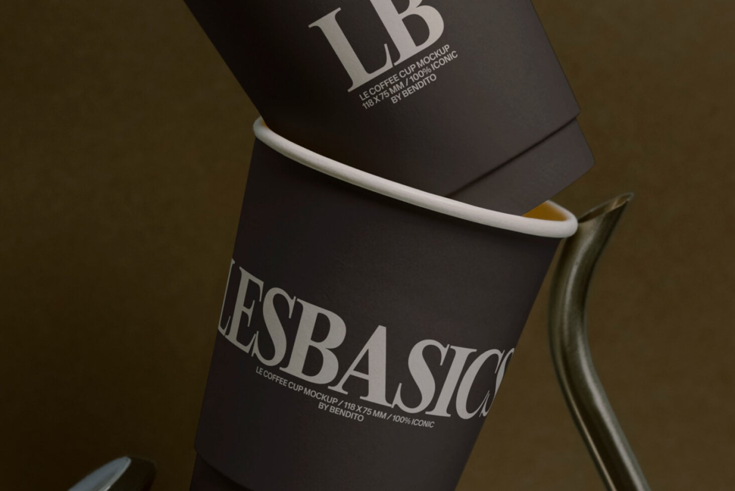 Close-up of black paper coffee cup with white band label showing typography details