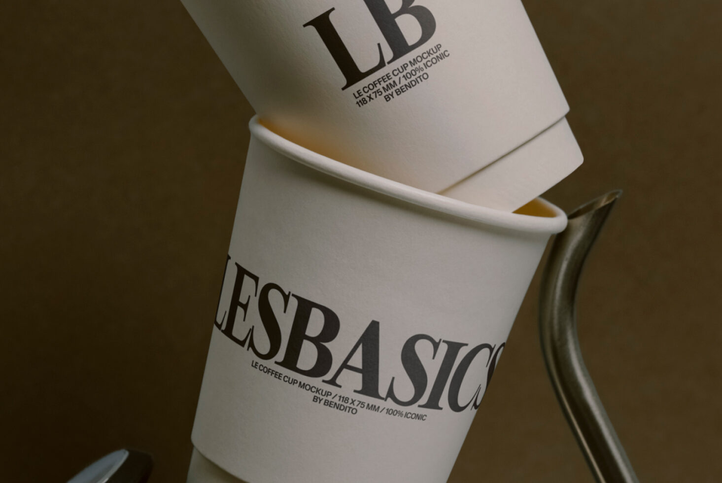 Close-up of white paper coffee cup with white band label on metal base