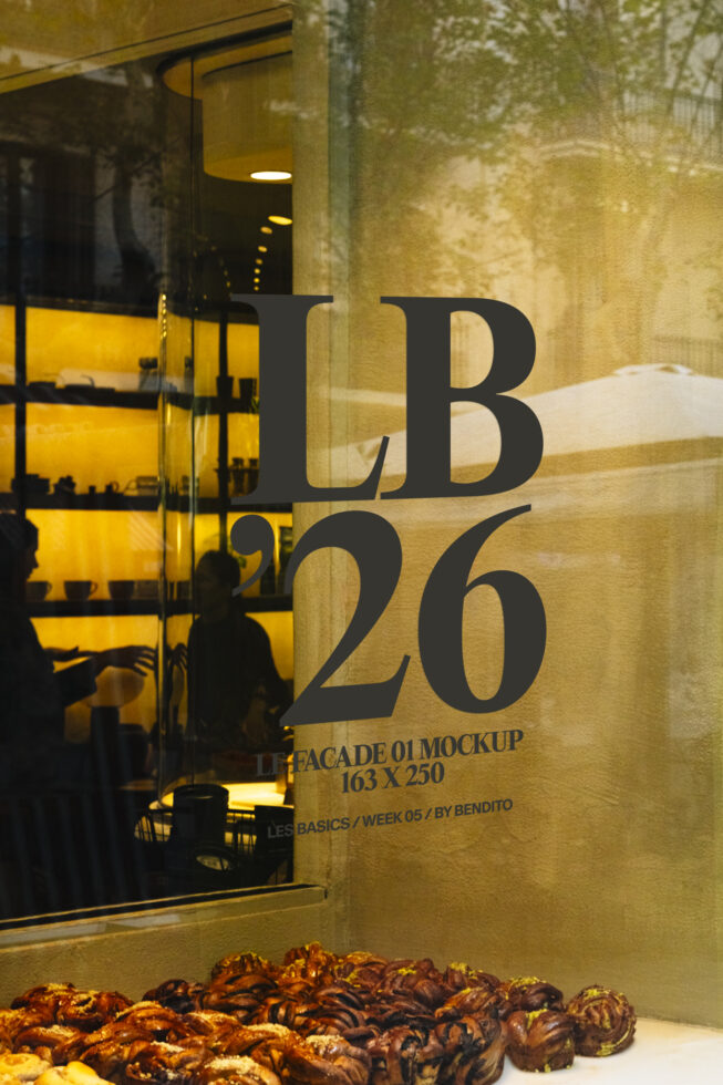 Dark storefront window with large typography mockup over textured wall