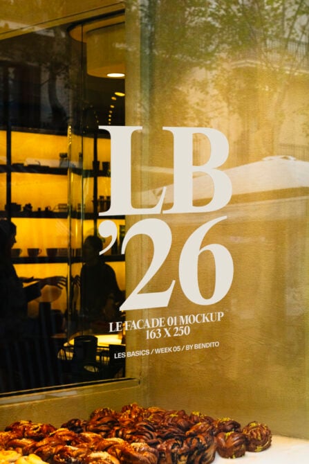 Light storefront window with large typography mockup over textured wall