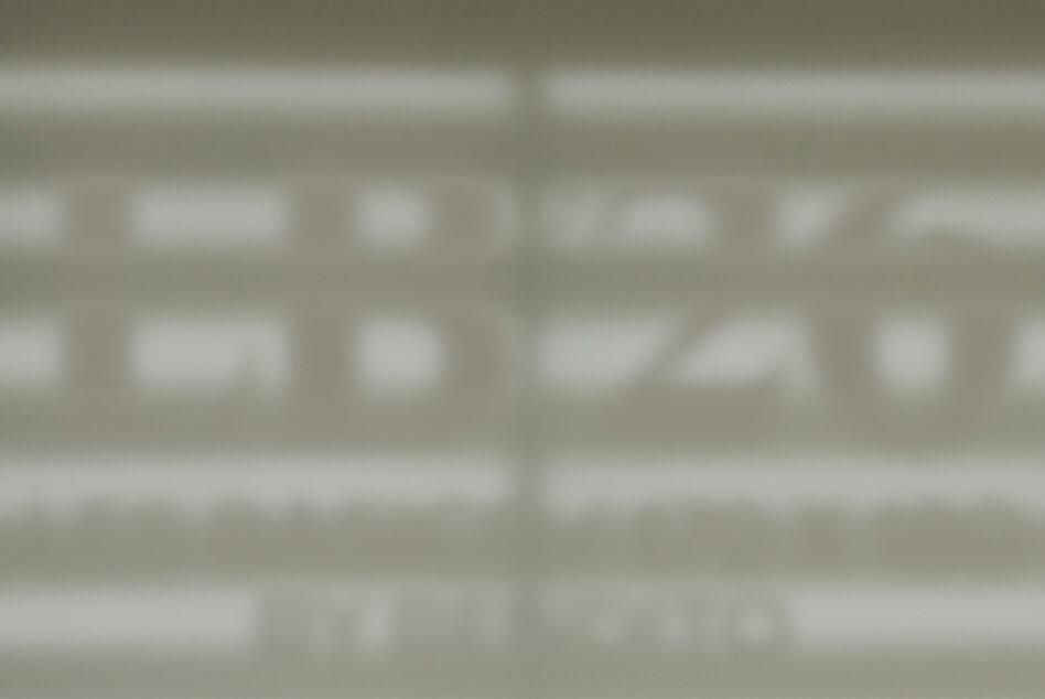 Blurred storefront window mockup showing facade signage display