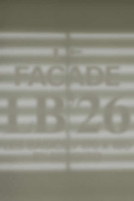 Blurred storefront window mockup showing facade signage display