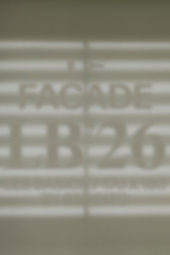 Blurred storefront window mockup showing facade signage display