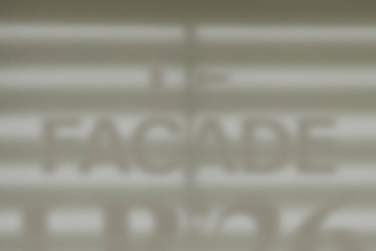 Blurred storefront window mockup showing facade signage display