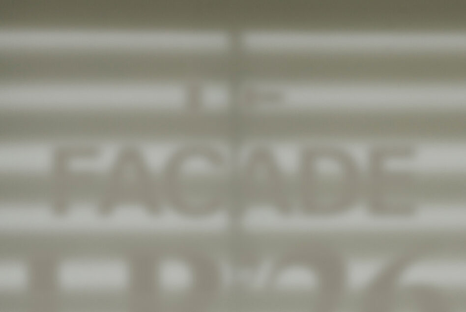 Blurred storefront window mockup showing facade signage display