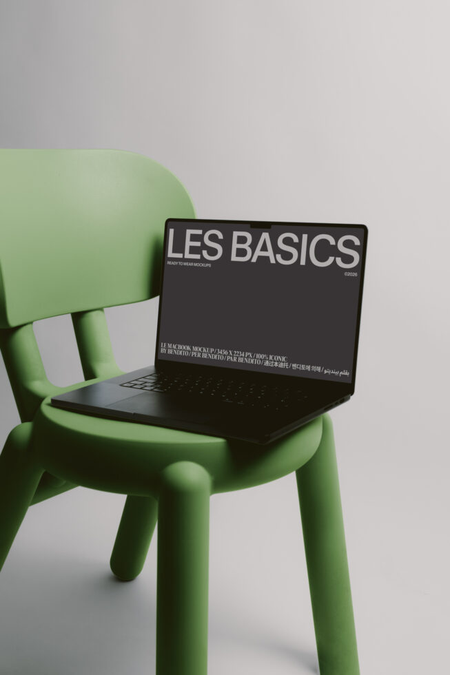 Laptop mockup on lime green chair displaying Les Basics dark screen design