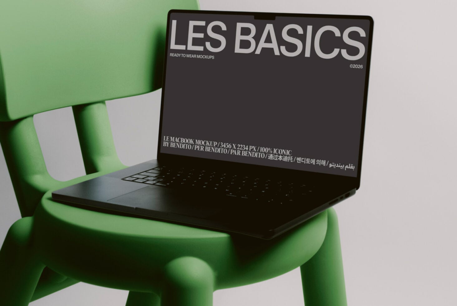 Black laptop sitting on bright green sculptural chair showing Les Basics display