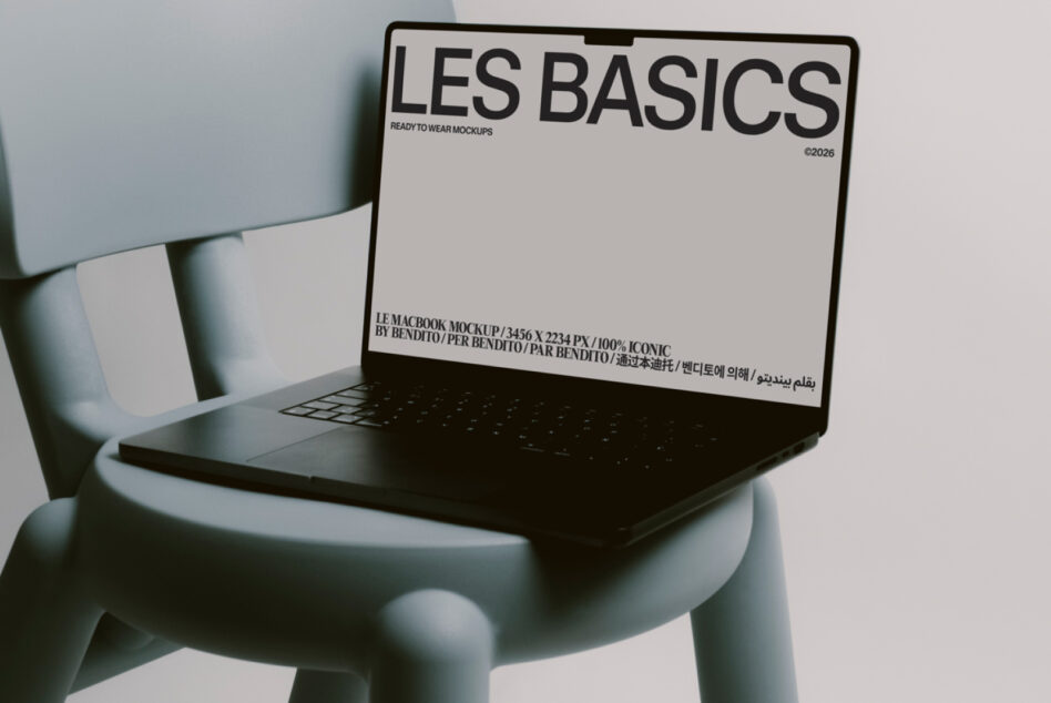 Laptop mockup on gray-blue chair with Les Basics cream screen presentation