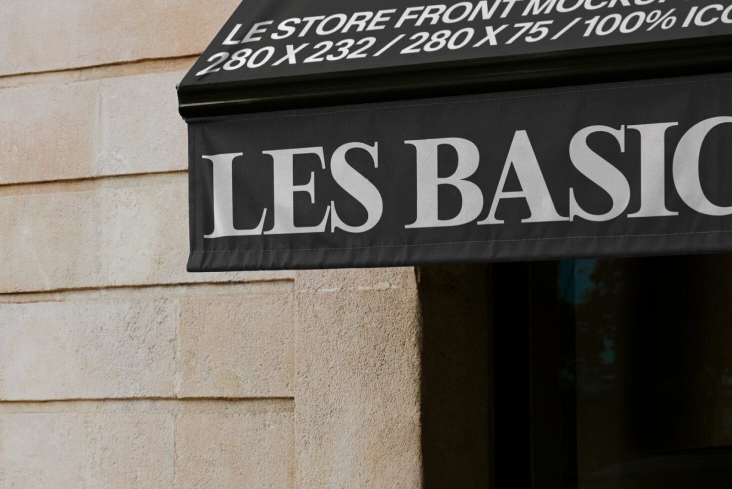 Close up of black awning with large white serif typography Les Basiq on facade