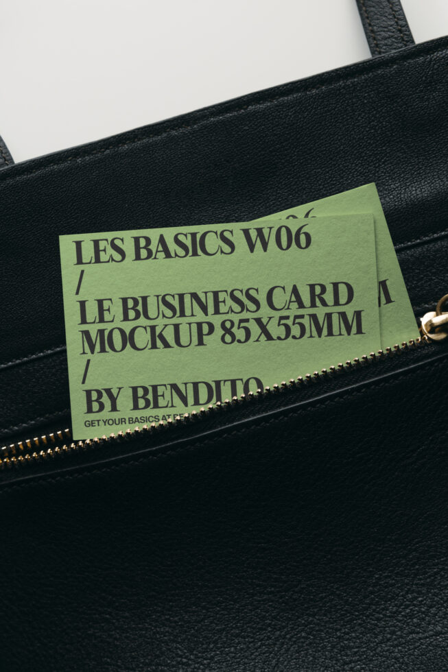 Lime business card mockup tucked into black leather bag pocket