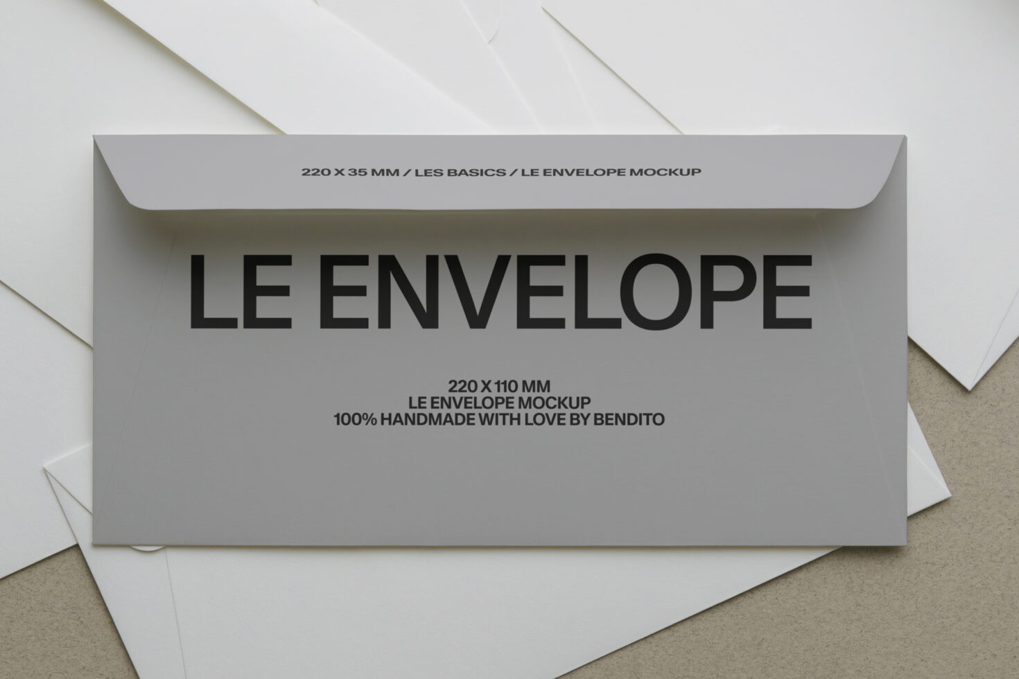 Gray envelope mockup with Le Envelope text, handmade branding by Bendito on beige background