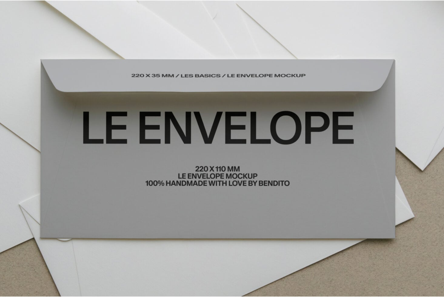 Gray envelope mockup with Le Envelope text, handmade branding by Bendito on beige background