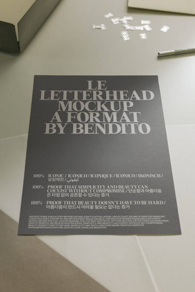 Dark letterhead mockup on desk with pen, business cards scattered above