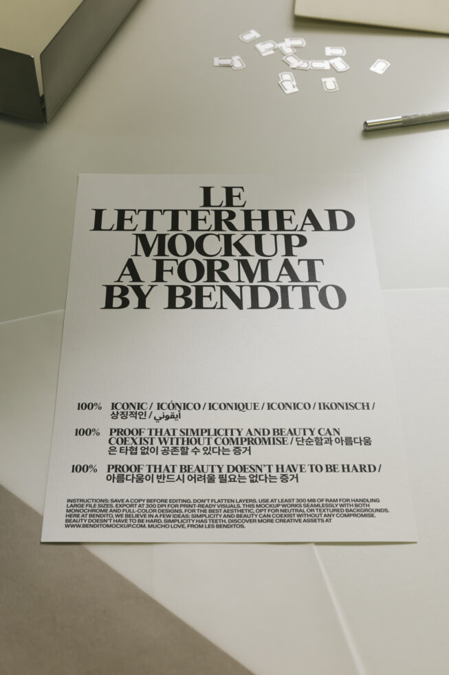 Light letterhead mockup on desk with pen, business cards scattered above