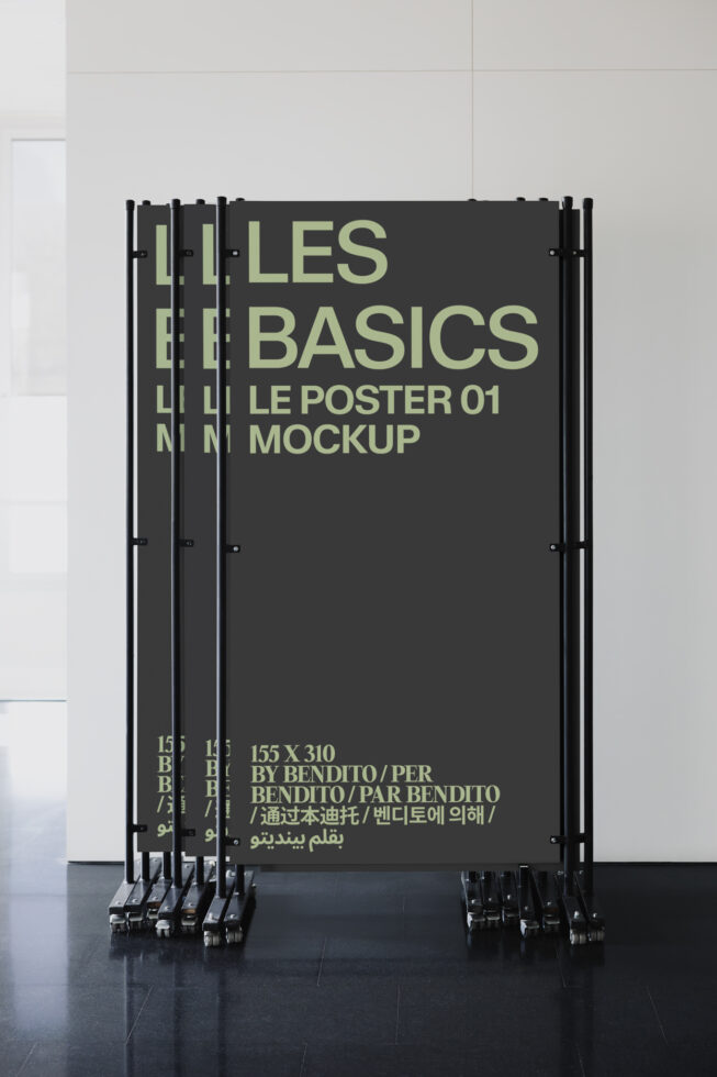 Barrier fence mockup displaying Les Basics poster on dark gray background