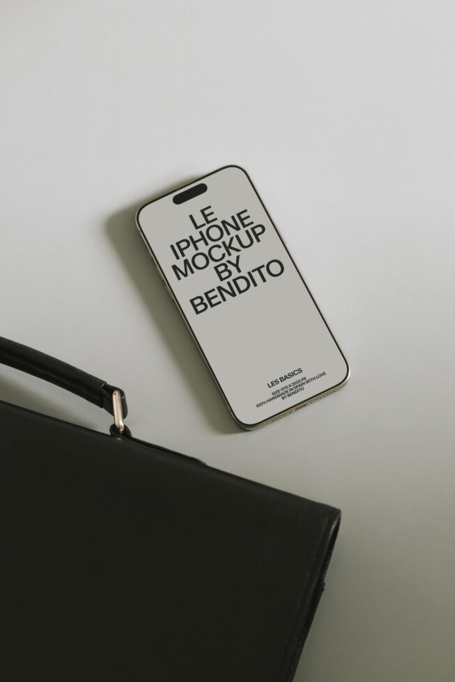 Cream iPhone mockup with dark text on neutral background beside minimalist black accessory