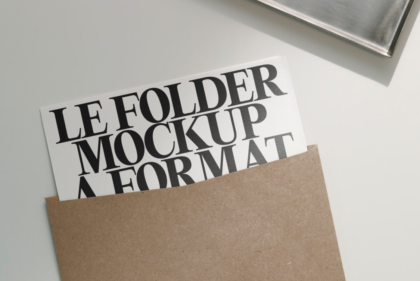 Kraft folder with white insert showing stacked serif lettering mockup
