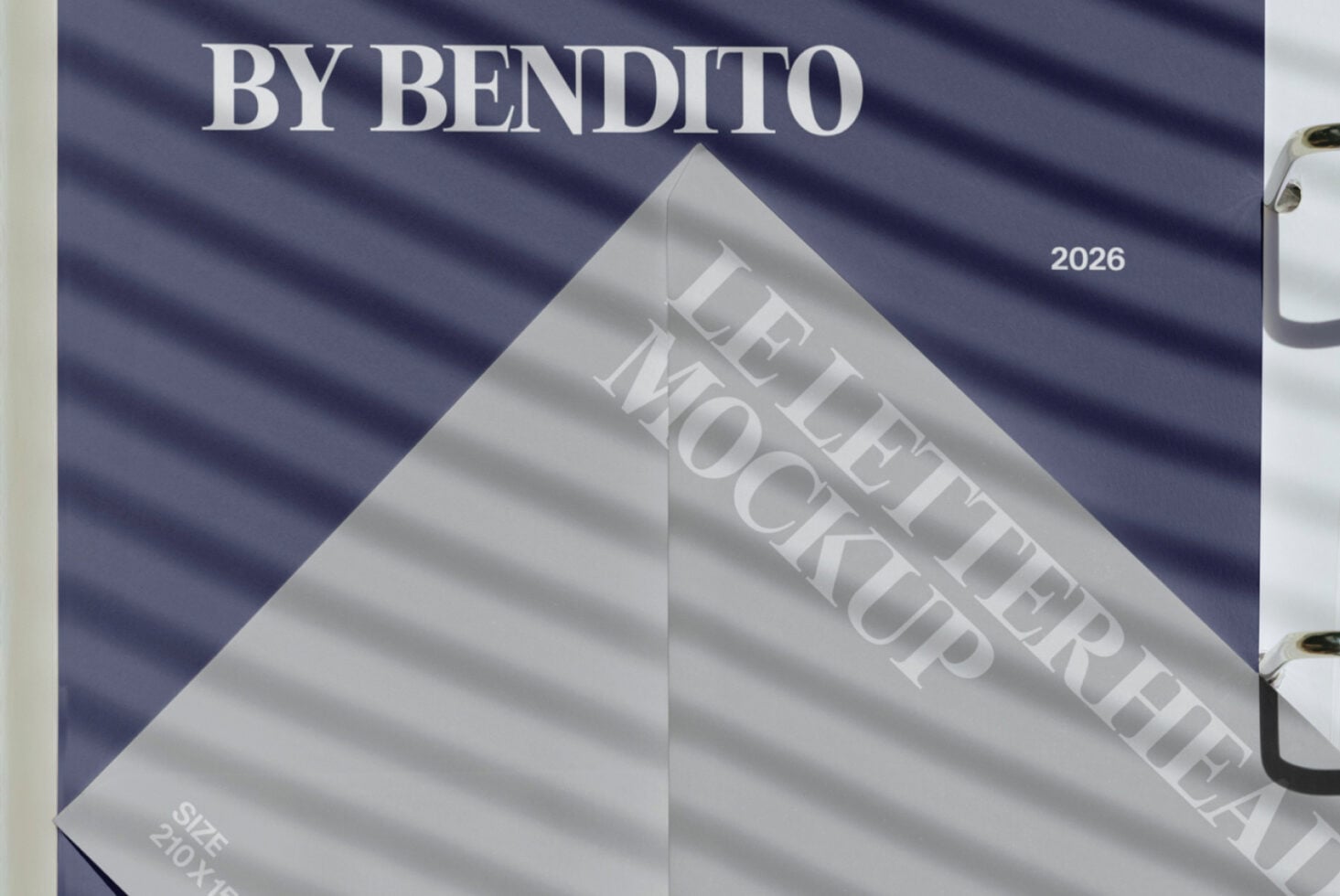 Close-up of folded letterhead mockup on dark blue fabric backdrop