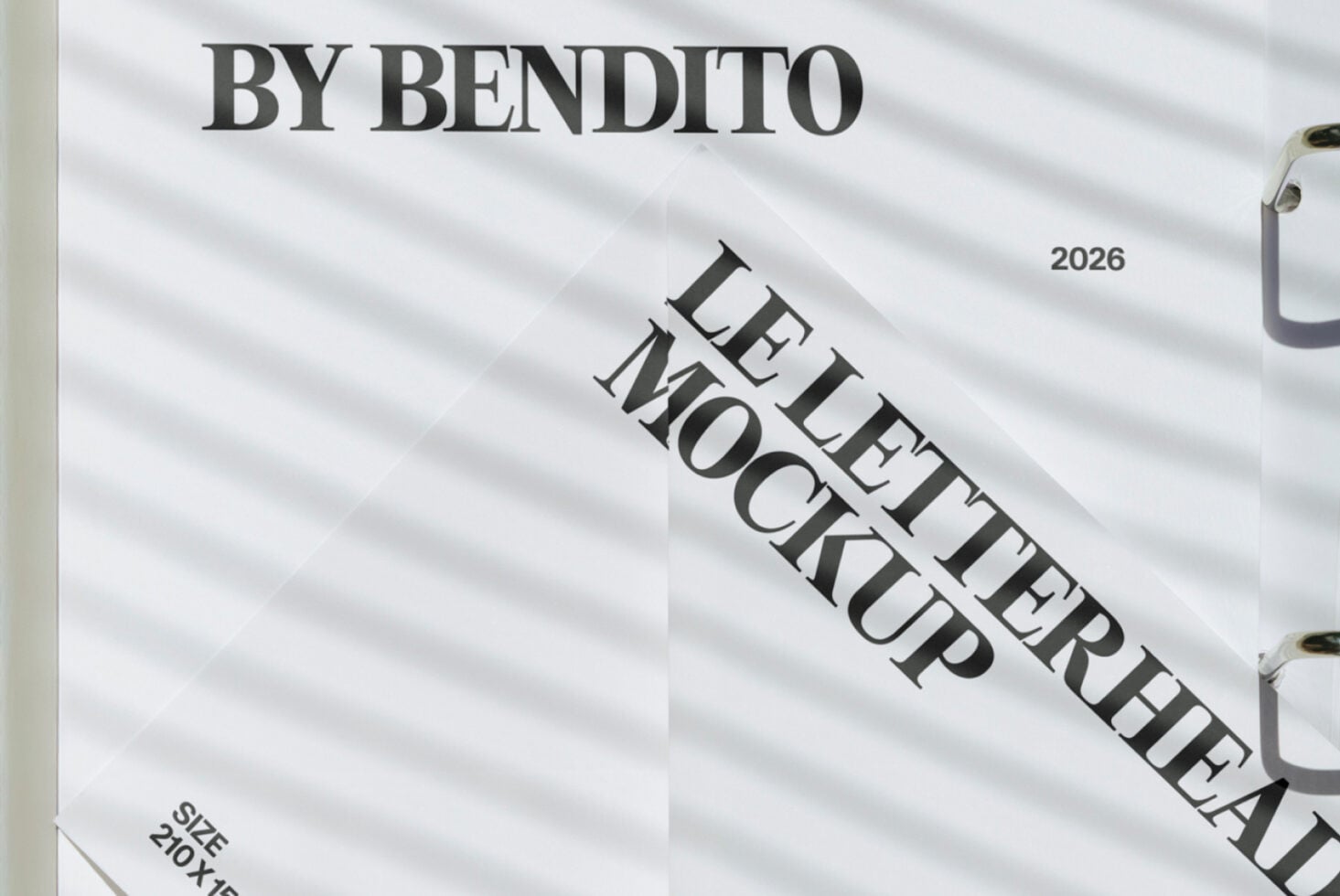 Close-up of folded letterhead mockup on light white fabric backdrop
