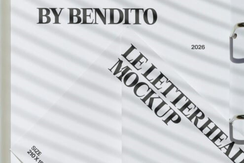 Close-up of folded letterhead mockup on light white fabric backdrop