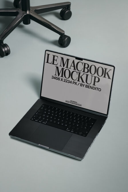 MacBook mockup displaying light screen beside modern task chair