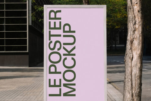 Pink poster mockup in street setting with architectural backdrop