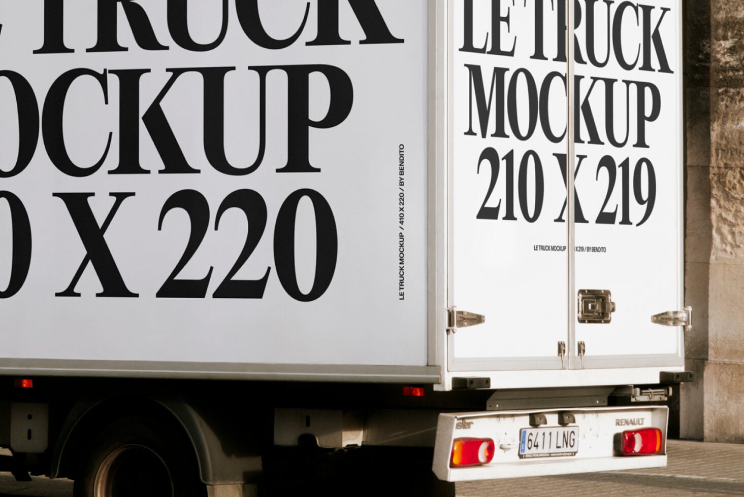 Close up of black text on white truck side panel showing 210x219 mockup dimensions