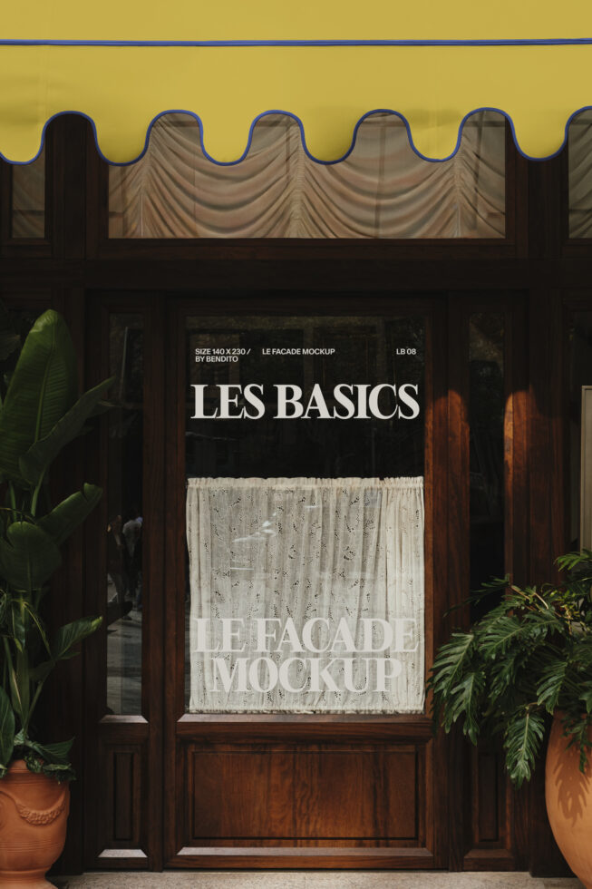 Shop storefront with yellow awning showing Les Basics signage in window