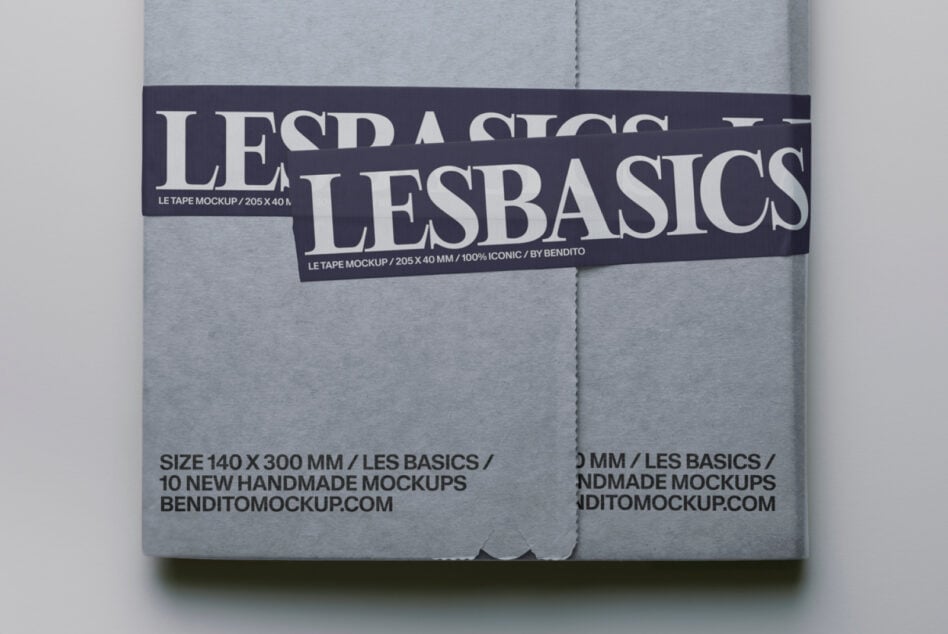 Gray mailer mockup tied with dark Les Basics tape featuring serif lettering