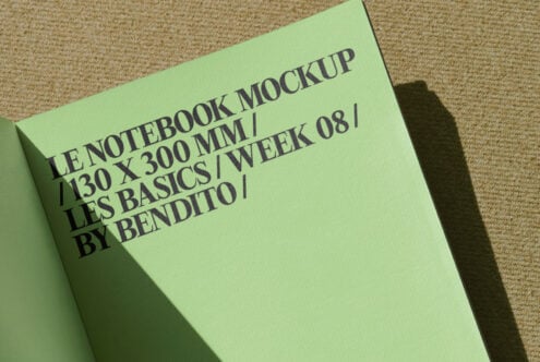 Chartreuse notebook mockup tilted on woven fabric showing front cover