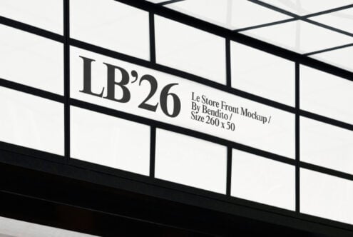 Minimalist storefront signage with grid windows displaying text LB'26