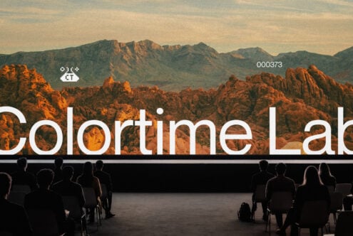 Desert landscape on projection screen with audience watching presentation