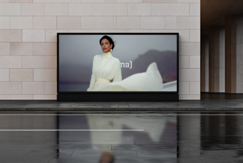 Horizontal billboard mockup showing woman in white dress on beige wall