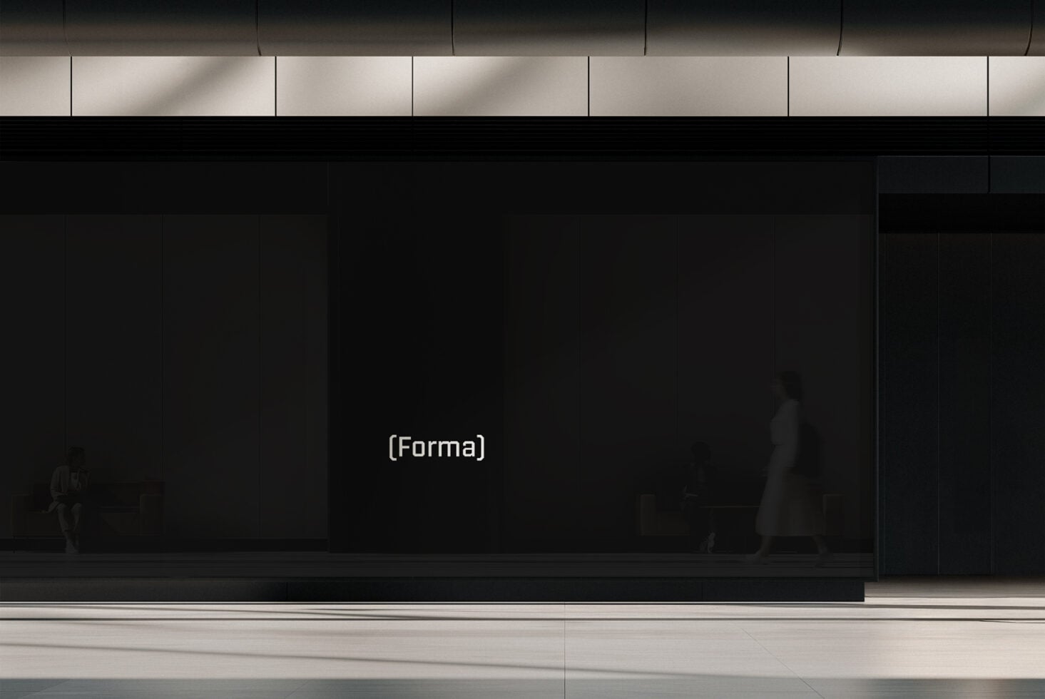 Dark storefront display with minimal signage in urban setting