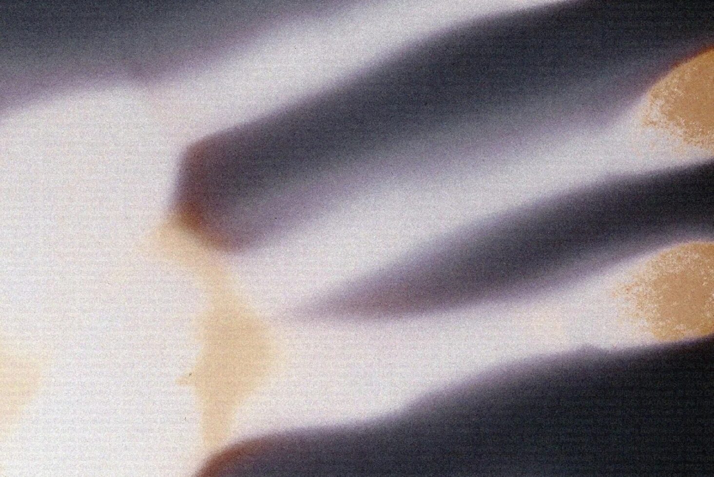 Close-up fabric texture with soft shadows, cream tan neutral tones