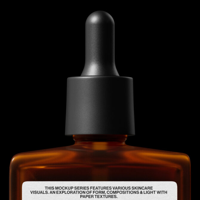 Amber glass dropper bottle with black cap isolated on black background